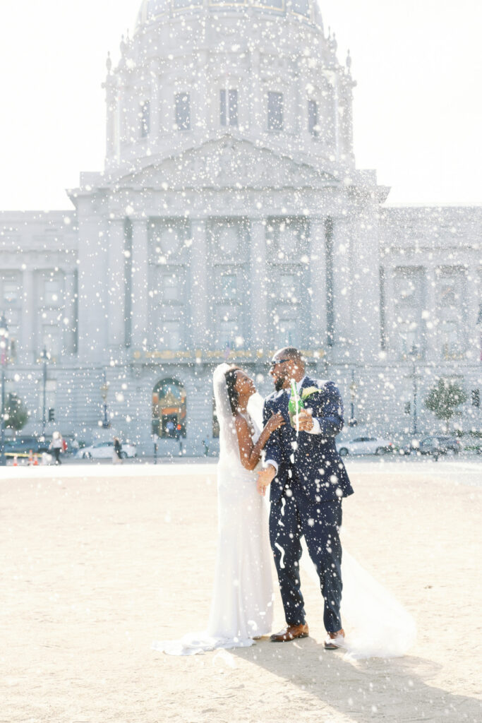san francisco city hall wedding champagne pop celebration