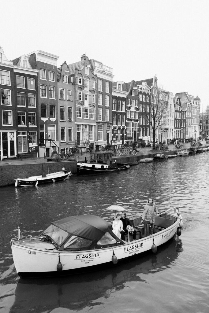 Romantic Amsterdam canal engagement session photographed by a destination wedding photographer