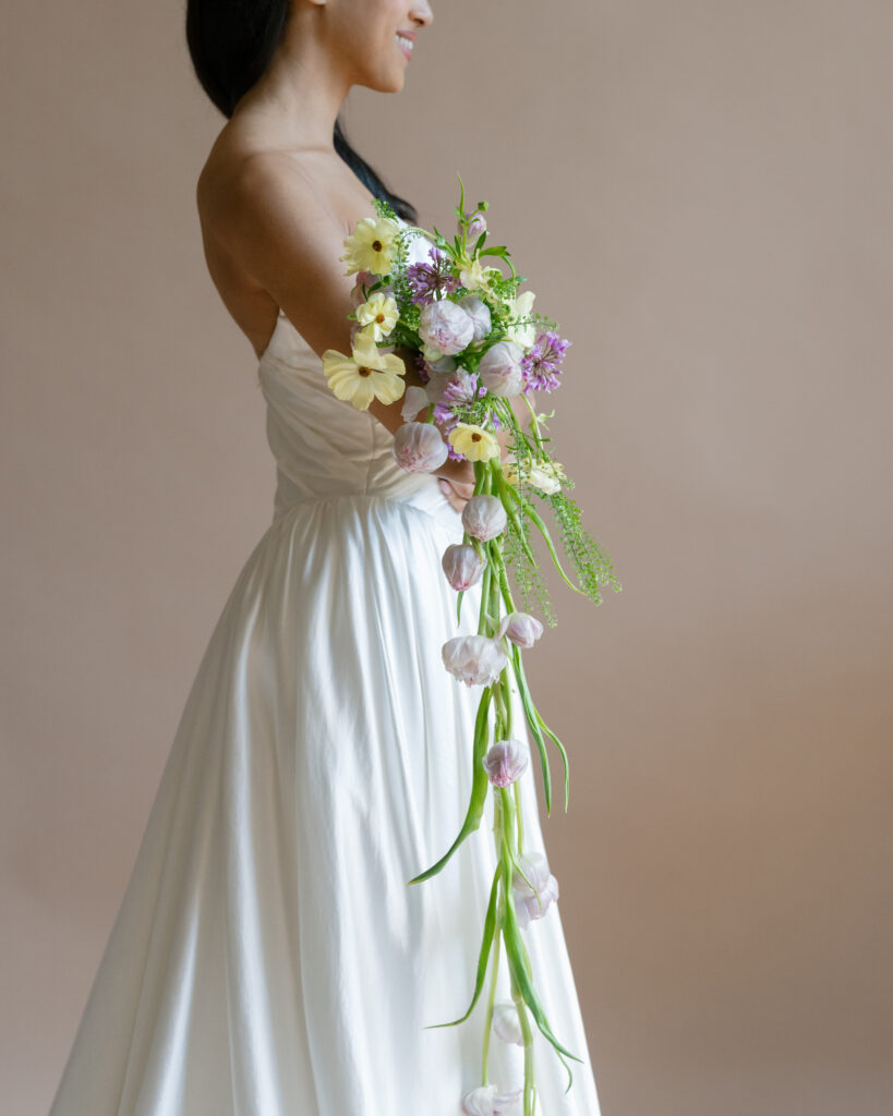 Romantic editorial bridal photography capturing soft light and elegant movement in a Lace & Liberty gown.