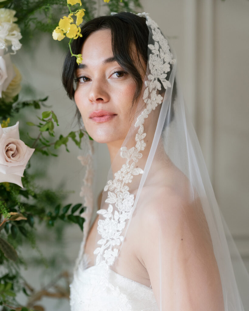 A bride wearing a Lace & Liberty gown captured in natural light during an Editorial Bridal Photography catalogue shoot.